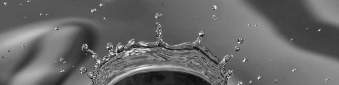 grayscale placeholder image of metallic-looking water splash